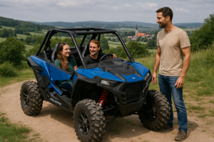 RZR vehicle on a dirt trail with driver and passenger